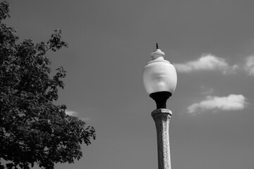 Lamp post in the city in black and white.