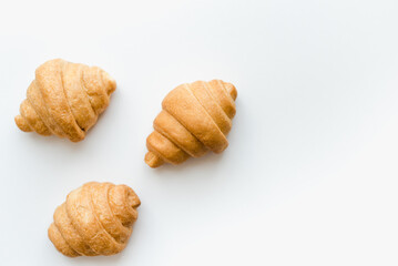 Fototapeta na wymiar Croissants on a white background. Baking on a white background.