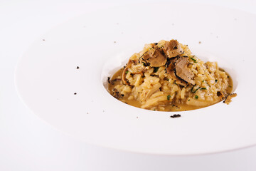 Creamy cheese risotto with slices of truffle