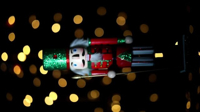 Christmas nutcracker with Christmas tree in background