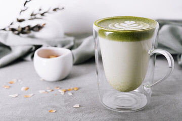 Green matcha latte with pistachios close up