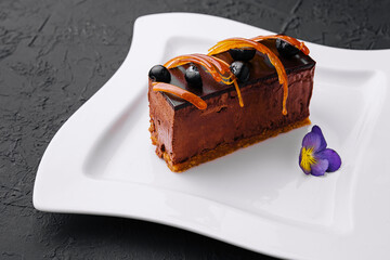 Chocolate cheesecake with fresh berries on plate