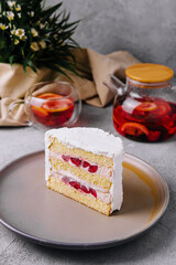Biscuit cake with strawberry filling and tea