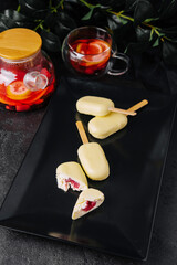 dessert from ice cream lolly with white chocolate coating