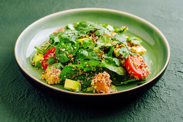 Salad with salmon, couscous, avocado and tomatoes