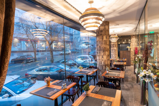 Interior Of A City Restaurant With Large Display Window