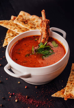 Spicy Soup With Pork Rib On Bowl And Focaccia