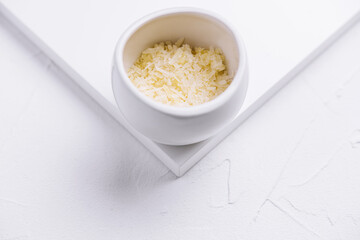 grated parmesan cheese in ceramic bowl