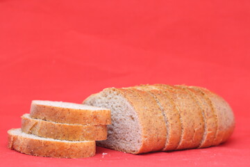 Loaf of bread, cut into slices, fresh bread.