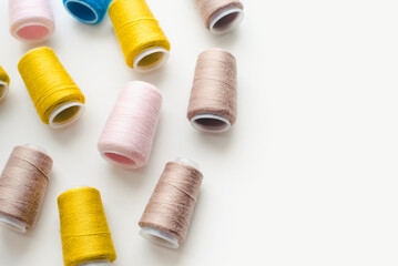 Thread spools. Bobbins with colored threads.