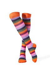 Detailed shot of color bright knee-high socks with a rubber band and a striped print. The socks are shaped as human legs. The unisex knee socks are isolated on a white background.