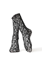 Detailed shot of black openwork translucent socks with a rubber band and abstract pattern. The socks are shaped as human legs. The fishnet semitransparent socks are isolated on a white background.