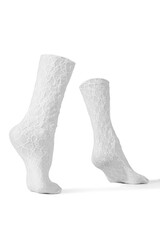 Detailed shot of white openwork translucent socks with a rubber band and abstract pattern. The...