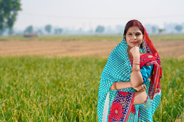 Indian rural woman standing at agriculture field