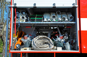 Part of equipment of a firetruck: hoses, valves and syringe of a water pump