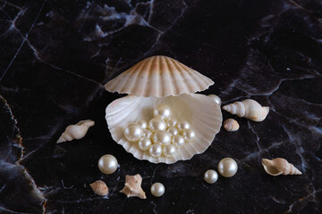 a few pearls in a sea shell