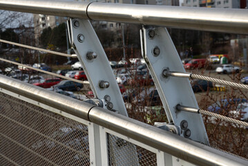 wire mesh fencing with a stainless steel guide wire and a tensioning mechanism with a threaded...