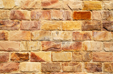 Wall of colored cracked bricks. Horizontal image. Advertising space.