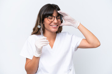 Dentist caucasian woman holding tools isolated on white background smiling a lot