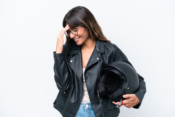 Young caucasian woman with a motorcycle helmet isolated on white background laughing