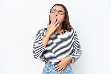 Young caucasian woman isolated on white background yawning and covering wide open mouth with hand