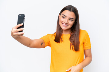 Young caucasian woman isolated on white background making a selfie