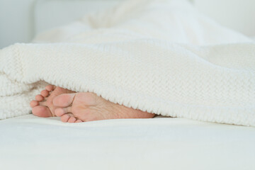 feet in bed