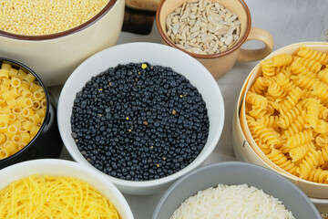 Lentil in bowl. Protein pulse that is dried and then soaked and cooked before eating. Vegan organic product.
