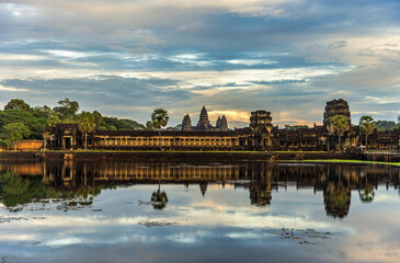 Angkor Wat at sunset, reflected in the water of the moat