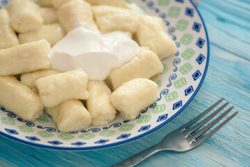 syrniki, cottage cheese sticks with sour cream