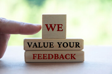 We value your feedback text on wooden blocks. Feedback and review concept