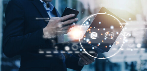 Contact us or Customer support hotline people connect. Businessman using a laptop and touching on virtual screen contact icons ( email, address, live chat, internet wifi ).
