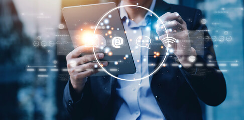 Contact us or Customer support hotline people connect. Businessman using a laptop and touching on virtual screen contact icons ( email, address, live chat, internet wifi ).