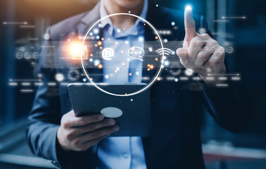Contact us or Customer support hotline people connect. Businessman using a laptop and touching on virtual screen contact icons ( email, address, live chat, internet wifi ).