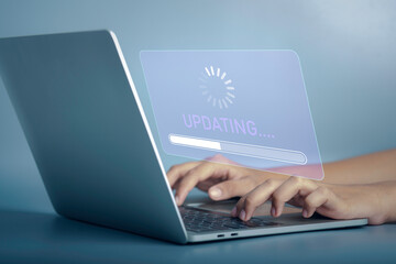 Installing software update process, operating system upgrade concept. Hand using laptop with...