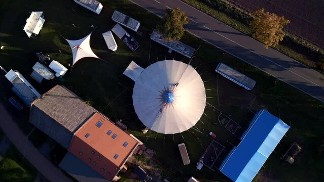 Travelling circus, caravans, trucks and tents. Majestic aerial view flight drone