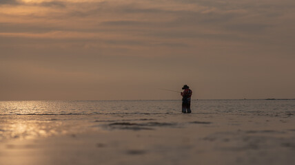 Fototapeta na wymiar Fishing on the beach