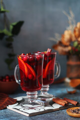 Two glasses with cranberry drink in autumn rustic style