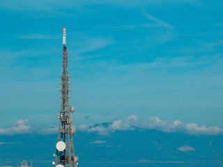 Antenna for telecommunications, radio and television transmitting apparatus, electrical and electronic apparatus. City skyline. Vibo Valentia, Calabria. Italy