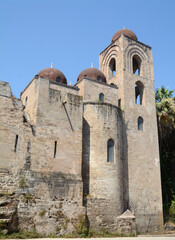 Fototapeta premium San Giovanni degli Eremiti dates back to 1132, the cloister, the cubic bodies and the hemispherical domes are wonderful. It is a typical example of the Byzantine style.