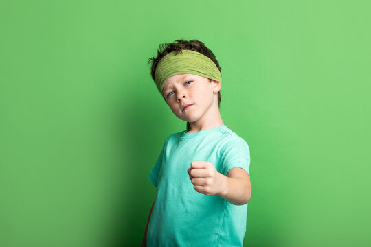 Boy with showing clinched fist