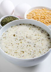 Traditional yayla soup (yogurt soup) on stone background