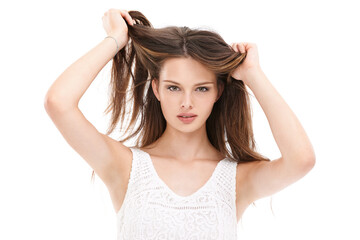 Fototapeta premium Portrait, hair and beauty with a model woman in studio on a white background for keratin treatment at a salon. Face, haircare and natural aesthetic with a young female holding her straigh hair
