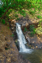 Fototapeta na wymiar Arvalem waterfall in March. Goa. India