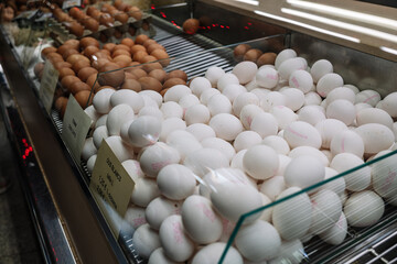 white eggs at a market stall