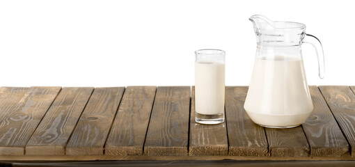 White milk in a glass and the jug
 on desk