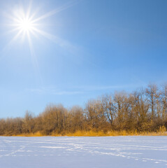 frozen winter river at cold sunny day