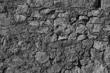 gray background, in the photo an old gray stone wall close-up