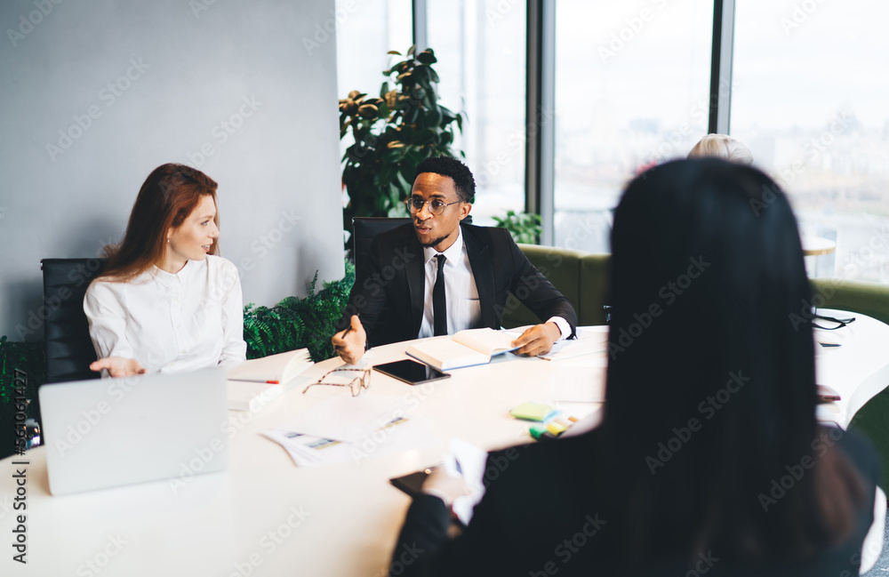 Sticker Diverse professionals briefing on new project while sitting with Manager in office