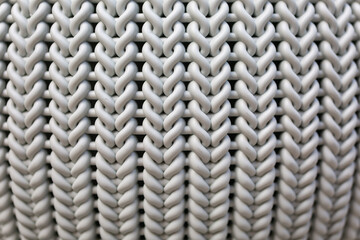 The structure of a knitted fabric made of plastic, selective focus